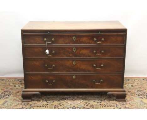 George III mahogany chest, of large size with caddy moulded top and brushing slide over four long graduated drawers on ogre b