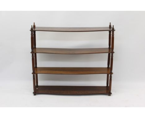Victorian mahogany hanging wall shelf, four shaped open shelves between turned supports, 98cm wide
