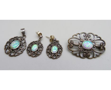 A silver and synthetic opal jewellery set - a brooch, a pair of earrings and a pendant, 13g