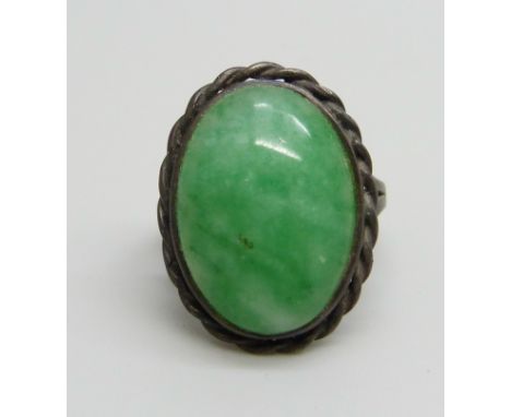 A silver ring set with jade, J