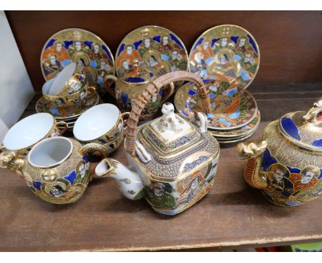 A Japanese hand painted Satsuma tea set, seven side plates, six cups and saucers, tea and coffee pots and sugar basin**PLEASE