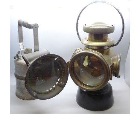 A Wolf Safety Lamp Co. lamp and a rear brass lamp, circa 1905, probably Lucas