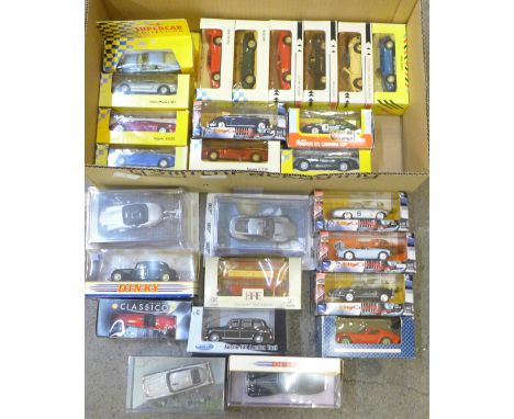 A box of model vehicles including Matchbox, Dinky and James Boned themed