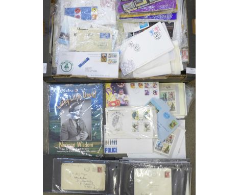 A box of mixed first day covers, stamps, presentation packs, etc., also noted some USA stamps, an album of "Paquebot" covers 