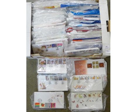 A carton of approximately 500 first day covers 2000-2004 with most sets duplicated, all unaddressed, includes booklet panes, 