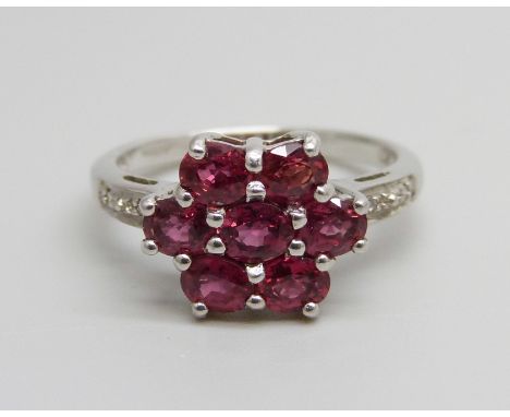 A 9ct white gold ruby and diamond cluster ring, 3.2g, N