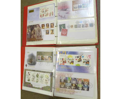 A 2009-2013 range of over 100 first day covers with sets, mini-sheets and "Post and Go" issues housed in two red albums