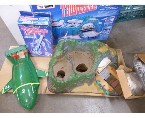 A boxed Thunderbirds Tracey Island Electronix playset, a Thunderbird 2 model and a Matchbox Electronic Thunderbird 1
