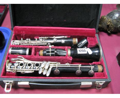 A Boosey and Hawkes Five Piece Clarinet, the mouthpiece stamped "H45" in a plush lined case.