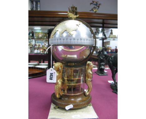 A Devon Clocks 'Greenwich Meridian' Clock, the ship finial above a gilt and plated terrestrial globe with meridian and equato