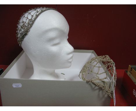 A c.1920's Diamanté Openwork Skull Cap, together with a similar pearl example. (2)