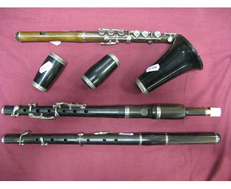 An Early XX Century Rosewood Cased Clarinet, with bone mouthpiece, and two others similar.