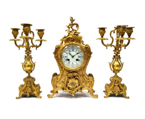 An Early XX century French Gilt Metal Three Piece Clock Garniture, the clock inscribed "A. Chapus, Paris" with eight day move