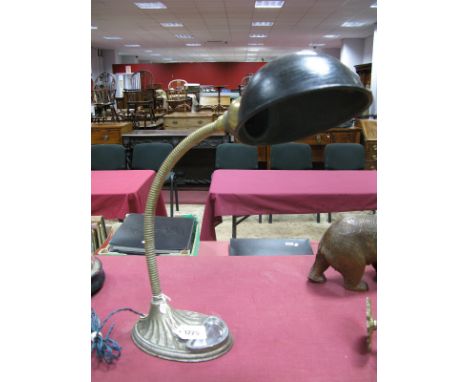 An Early XX Century Adjustable Desk Lamp, with heavy base with ashtray, painted black circular shade.
