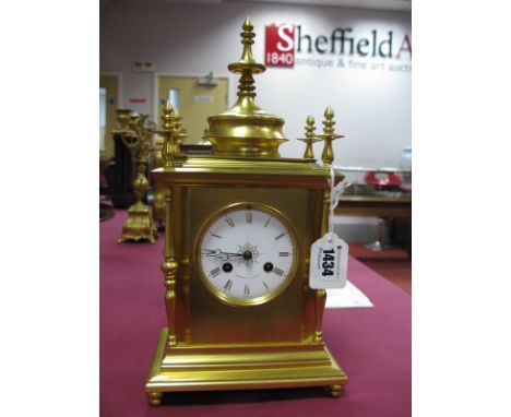 A Howell &amp; James Late XIX Century Striking Gilt Metal Mantel Clock, of chamfered rectangular form with four turned column