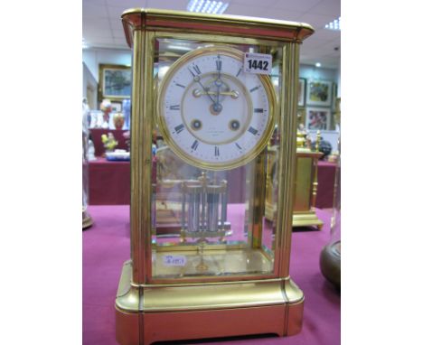 A Late XIX Century Gilt Metal Rectangular Mantel Clock, with bevelled glass sides and shaped base, the eight-day movement str