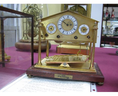 A Devon Clocks 'Congreve Rolling Ball' Clock, the centre white enamel dial with Roman numerals flanked by subsidiary dials fo