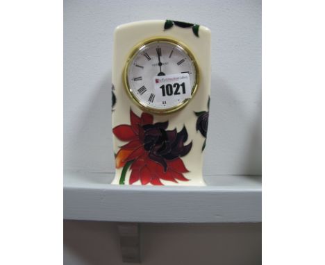A Moorcroft Pottery Clock, painted in the 'Ruby Red' pattern, designed by Emma Bossons, impressed and painted marks, 15.5cm h
