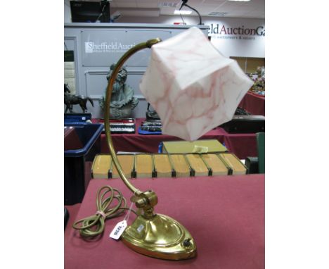 An Early XX Century Brass Desk Lamp, with adjustable joint, with mottled pink glass shade, 42cm high.