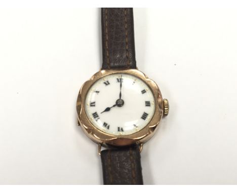 A Vintage 9carat gold ladies watch with a leather strap.