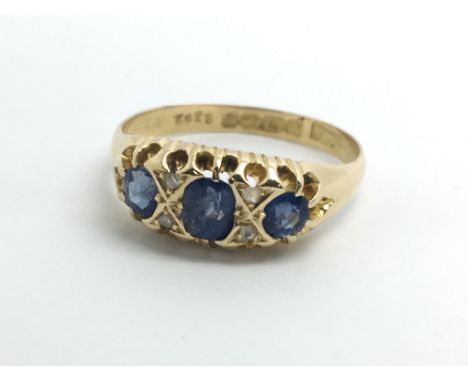 A vintage 18ct yellow gold sapphire and diamond ring, approx size T