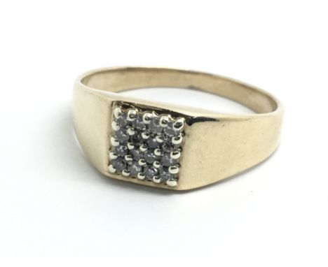 A gents 9ct yellow gold and sixteen stone diamond signet ring, size approx V