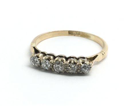 An 18ct yellow gold ring set with a row of five diamonds, approx 0.25ct, ring size approx O/P