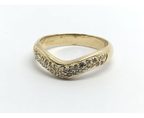 An 18ct yellow gold and diamond wishbone shaped ring, approx 0.20ct, ring size approx M