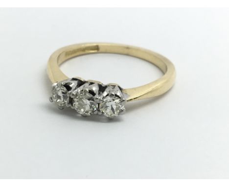 An 18ct yellow gold ring set with three diamonds, approx 0.25ct, ring size approx J