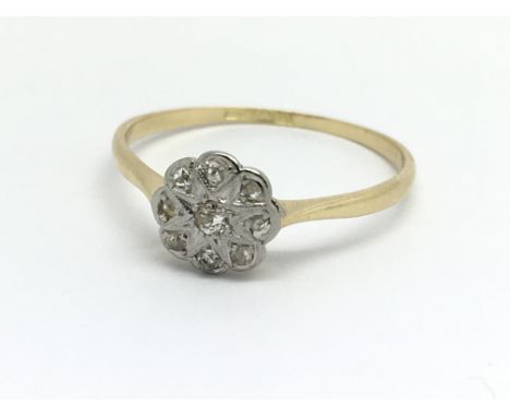 A vintage 18ct yellow gold and nine stone diamond ring cluster ring, size approx N