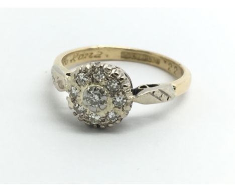 An 18ct yellow gold and diamond cluster ring, size approx K/L