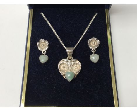 A jade and silver heart shaped pendant and earrings set