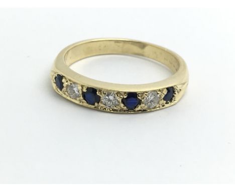 A 18ct yellow gold half eternity ring, consisting of alternating sapphires and diamonds, ring size approx M