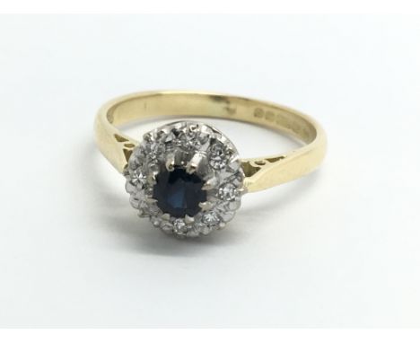 An 18ct yellow gold, sapphire and diamond cluster ring, size approx L/M