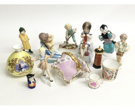 A selection of Royal Worcester and Royal Crown Derby ceramics, including Worcester figure August, ˜Threes Company™, The Slide