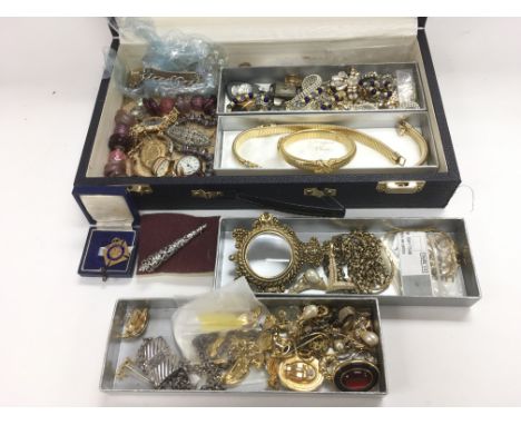 A collection of costume jewellery including a marcasite brooch, various necklaces, I.D. bracelet etc in a Christian Dior jewe