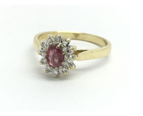 An 18ct yellow gold, ruby and diamond ring, size approx M