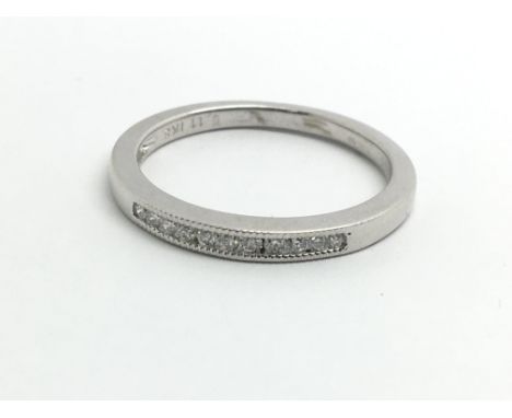 An 18ct white gold and small diamond half eternity ring, approx 0.10ct