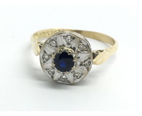 An 18ct yellow gold sapphire and diamond ring, approx size N/O