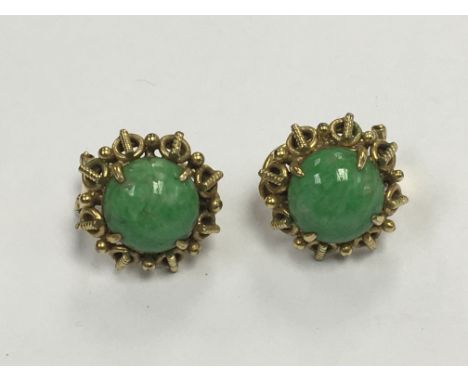 A pair of 14carat gold 585 marked Clip on earrings set with jade type cabochon.