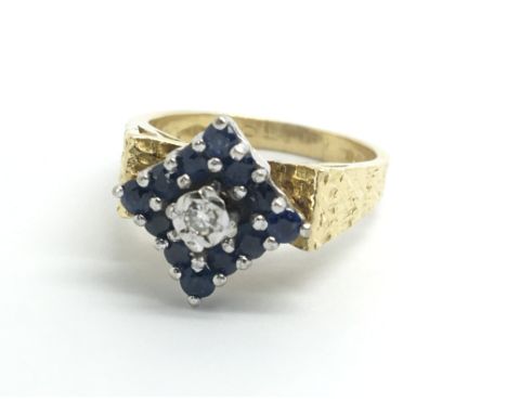 An 18ct yellow gold sapphire and diamond cluster ring, size approx J/K