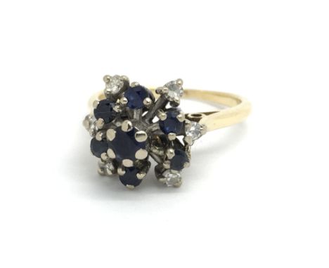 An 18ct yellow gold sapphire and diamond cluster ring, size approx H/I