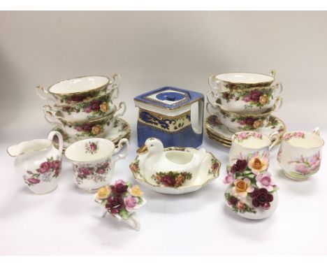 A set of six Royal Albert two handled cups and saucers in Old Country Roses pattern, a blue square teapot and other ceramic i