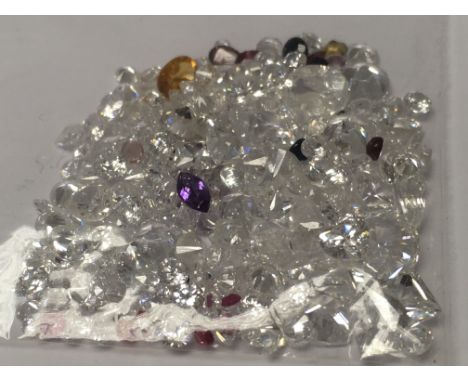 A bag of loose mixed stones including cubic zirconia, ruby, sapphire, amethyst and citrine, 90.00ct