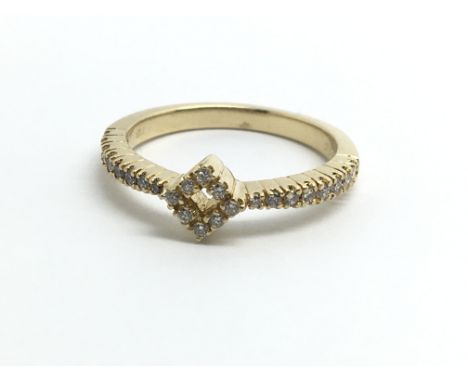 An 18ct yellow gold and diamond ring in modern design, approx size N