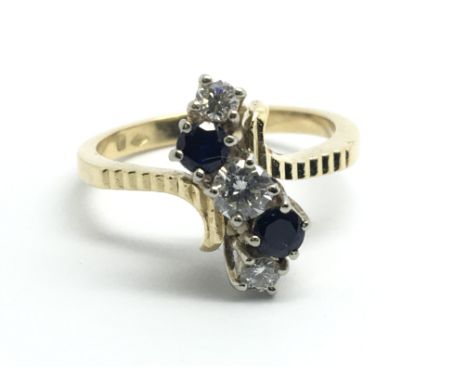 A 1950â€™s yellow gold ring, set with two sapphires and three diamonds, approx 0.33ct, ring size approx N