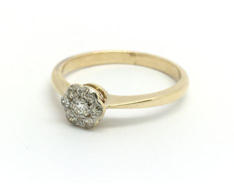 A gold seven stone diamond cluster ring, size approx Q/R