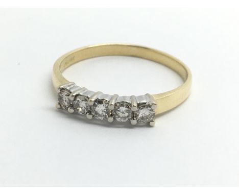 An 18ct yellow gold ring set with a row of five diamonds, approx 0.33ct, ring size approx M