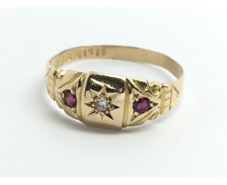 A vintage 18ct yellow gold diamond and ruby ring, approx size T