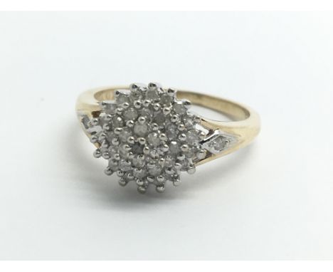 A 9ct yellow gold and diamond cluster ring, size approx I/J